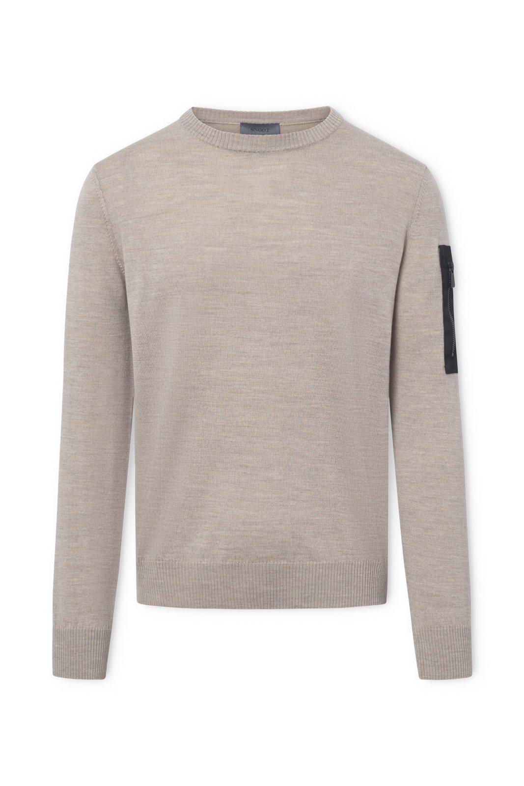 Beige sweater with a black patch on a white background